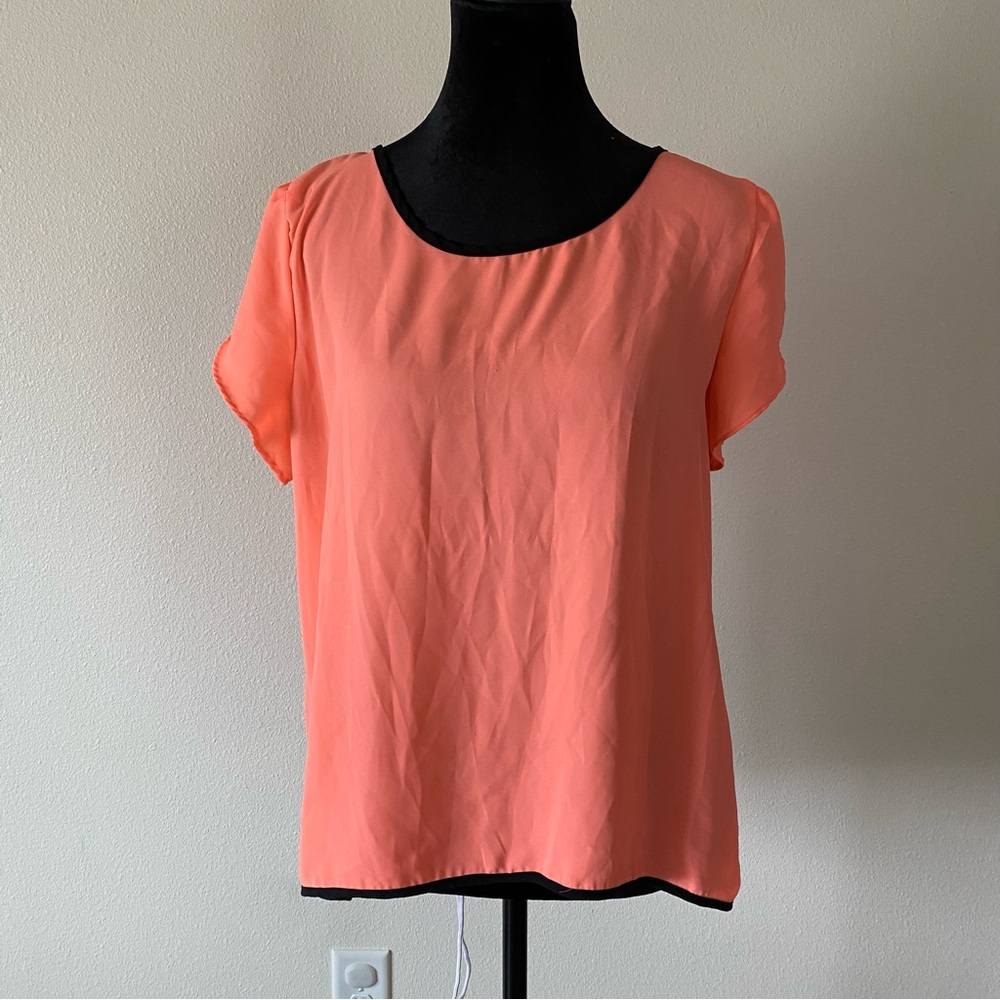 Vibrant Orange Top with Black Bow Accents